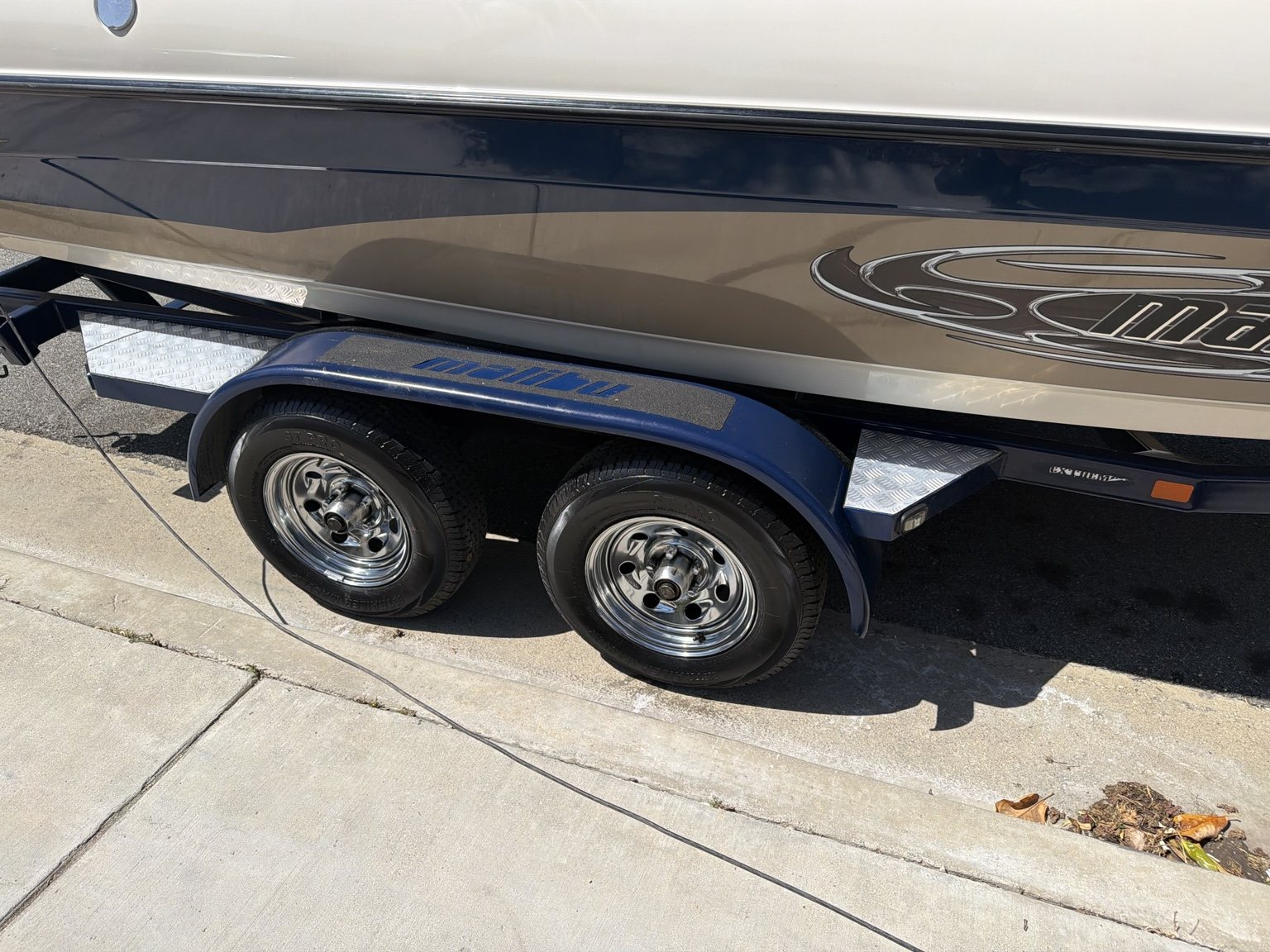 Detailed Malibu boat trailer and polished wheels