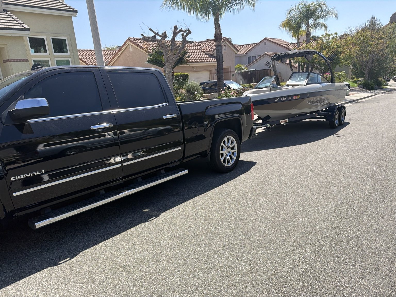 Mobile boat detailing truck towing a freshly detailed boat in Antelope Valley
